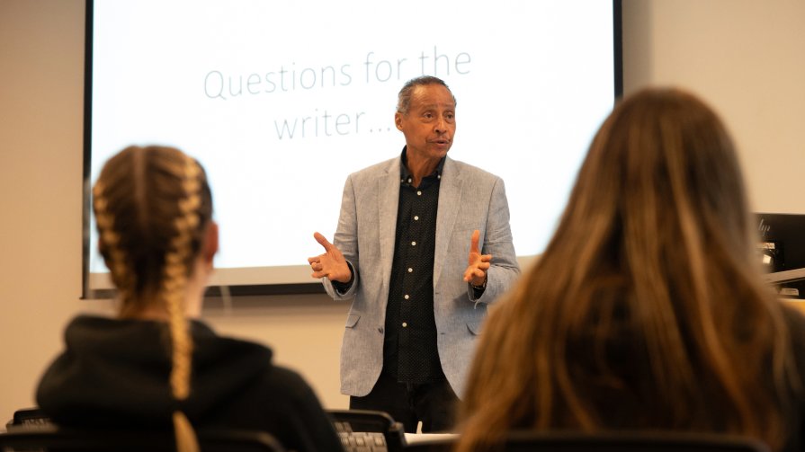 Jamal Joseph speaks to students at Bryant University.